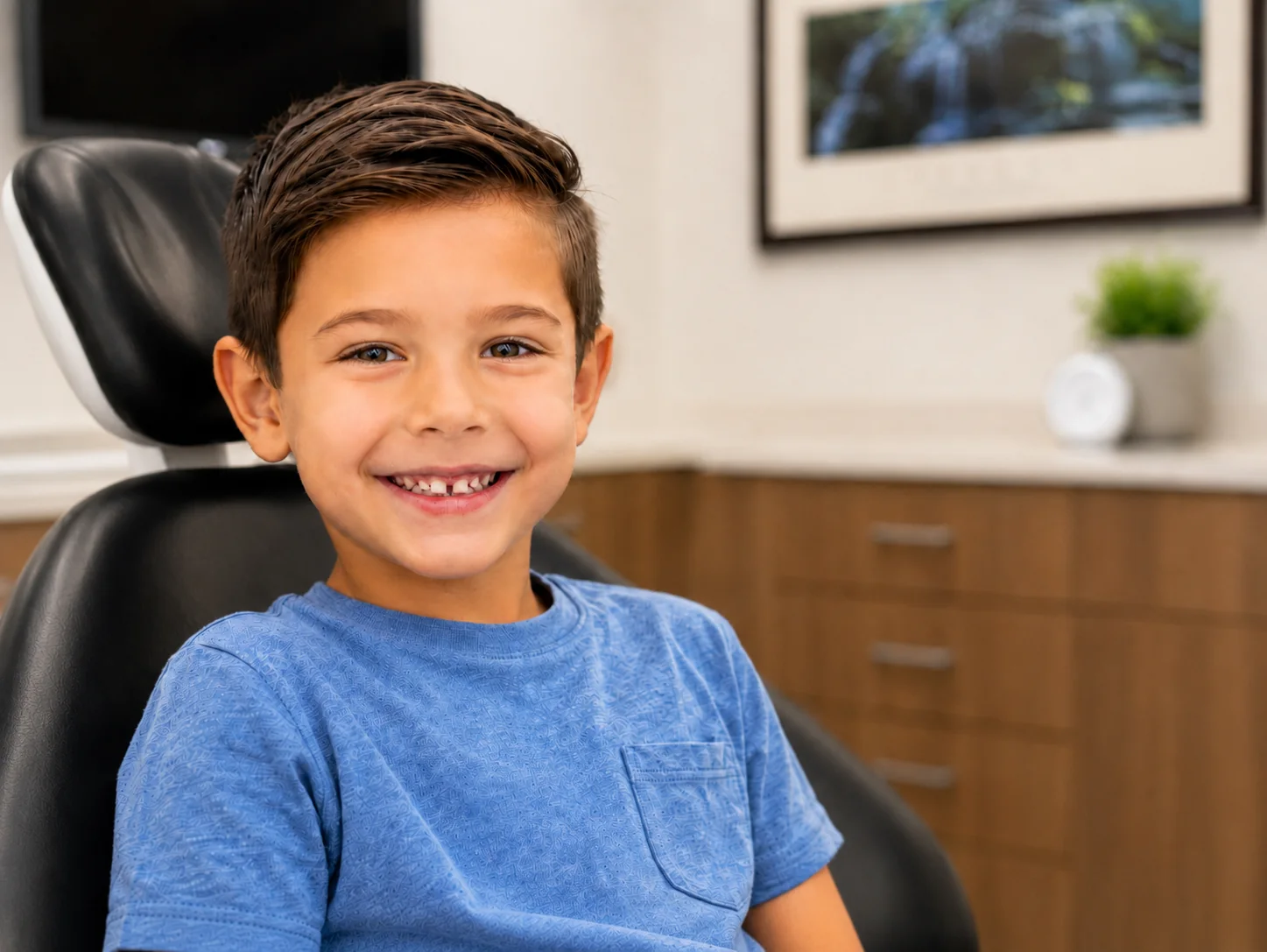 Young patient seated for an early orthodontic evaluation